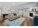 Spacious basement with a pool table, wet bar, comfortable seating, and a fireplace at 10597 Soulmark Way, Highlands Ranch, CO 80126