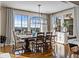 Bright dining room with hardwood floors, mountain views, and contemporary lighting at 10597 Soulmark Way, Highlands Ranch, CO 80126