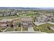 Aerial view of a two-story home featuring a meticulously landscaped yard and mountain views at 10597 Soulmark Way, Highlands Ranch, CO 80126