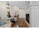 Cozy seating area with fireplace and adjacent staircase at 10597 Soulmark Way, Highlands Ranch, CO 80126