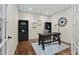 Cozy office with built-in bookshelves, a large desk, and natural light at 10597 Soulmark Way, Highlands Ranch, CO 80126