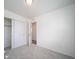 Neutral bedroom with sliding closet doors and neutral walls and carpet at 13545 E 103Rd Ave, Commerce City, CO 80022