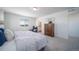 Bright bedroom with a large window, dresser, carpet, and a comfortable bed at 13545 E 103Rd Ave, Commerce City, CO 80022