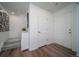 Bright entryway with wood-look flooring, white walls, and access to the staircase at 13545 E 103Rd Ave, Commerce City, CO 80022