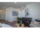 Elegant living room featuring modern decor, staircase access, and comfortable seating at 13545 E 103Rd Ave, Commerce City, CO 80022
