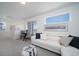 Open living room with modern furnishings, large windows, and plush gray carpeting at 13545 E 103Rd Ave, Commerce City, CO 80022