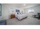 Main bedroom features plush gray carpet, neutral walls, and lots of natural light at 13545 E 103Rd Ave, Commerce City, CO 80022