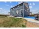 This home has a well-manicured yard, concrete patio with outdoor seating and basketball court at 7498 E 157Th Pl, Thornton, CO 80602