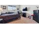 Cozy bedroom with a large window, carpet, and a work desk at 7498 E 157Th Pl, Thornton, CO 80602