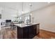 Bright and airy kitchen with an island and an open concept layout at 7498 E 157Th Pl, Thornton, CO 80602