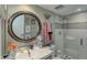 Bathroom featuring a frameless shower, modern vanity, and colorful decor at 2 Adams St # 809, Denver, CO 80206