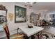 Dining room showcasing eclectic decor, a chandelier, and views to the living room at 2 Adams St # 809, Denver, CO 80206