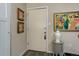 Entryway featuring an ivory front door, artistic decor, and wood-look flooring at 2 Adams St # 809, Denver, CO 80206