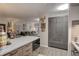 Open concept kitchen with gray cabinets, stainless steel appliances, and view to the living room at 2 Adams St # 809, Denver, CO 80206