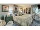 Cozy main bedroom with a beautiful bed, bedside tables, lamps and framed artwork at 2 Adams St # 809, Denver, CO 80206