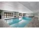 Indoor swimming pool with tiled deck and ample natural light at 2 Adams St # 809, Denver, CO 80206