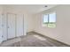 Cozy bedroom featuring plush carpet, a closet and a large window creating a relaxing ambiance at 1280 S Algonquian St, Aurora, CO 80018