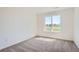 Well-lit bedroom featuring plush carpet, white walls and large windows creating a tranquil space at 1280 S Algonquian St, Aurora, CO 80018