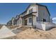 Charming townhomes featuring stone accents and modern design elements, creating curb appeal at 1280 S Algonquian St, Aurora, CO 80018
