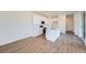 Open-concept kitchen featuring stainless steel appliances, center island and modern finishes at 1280 S Algonquian St, Aurora, CO 80018