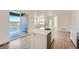 Modern kitchen features white cabinetry, stainless steel appliances and sliding glass door to deck at 1280 S Algonquian St, Aurora, CO 80018
