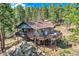 Beautiful home with mature trees and a large deck, perfect for outdoor entertaining and enjoying nature at 28669 Mountain View Rd, Conifer, CO 80433