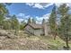 This home offers a serene natural setting, complemented by lush greenery and a harmonious blend with the outdoors at 28669 Mountain View Rd, Conifer, CO 80433