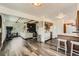 Open living space and eat-in kitchen and features modern flooring and an updated fireplace at 28669 Mountain View Rd, Conifer, CO 80433
