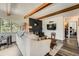 Comfortable living room with a cozy fireplace and exposed wood beams overhead at 28669 Mountain View Rd, Conifer, CO 80433