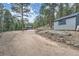 Picturesque mountain home features long driveway with detached shed for storage, set among beautiful trees at 28669 Mountain View Rd, Conifer, CO 80433