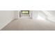 Spacious and bright attic with carpet flooring, a window, and a built-in closet at 2845 Quitman St, Denver, CO 80212