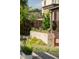 Backyard with colorful flowers, a retaining wall, and lush foliage at 2845 Quitman St, Denver, CO 80212