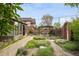 Secluded backyard featuring a pergola, lush greenery, and a well-maintained garden at 2845 Quitman St, Denver, CO 80212
