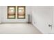 Bedroom with natural light from two windows and a vintage radiator at 2845 Quitman St, Denver, CO 80212
