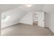Bright bedroom featuring a large skylight, neutral carpet, and an open doorway at 2845 Quitman St, Denver, CO 80212