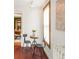 Cozy dining area with classic decor, comfortable seating, and a charming window with natural light at 2845 Quitman St, Denver, CO 80212
