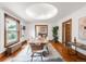 Bright dining room with hardwood floors, modern lighting, and a view to the kitchen at 2845 Quitman St, Denver, CO 80212
