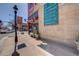 Commercial brick building with inviting street view; signage, street lamps, and sidewalk seating offer a lively atmosphere at 2845 Quitman St, Denver, CO 80212