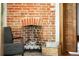 Close-up of a charming brick fireplace and wood storage at 2845 Quitman St, Denver, CO 80212
