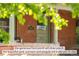 Charming brick home featuring a cozy front porch with classic architectural details at 2845 Quitman St, Denver, CO 80212