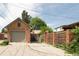 Detached garage with brick exterior and concrete driveway, offering ample parking space and backyard access at 2845 Quitman St, Denver, CO 80212