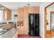 Charming kitchen featuring ample storage space, complemented by granite countertops and modern black appliances at 2845 Quitman St, Denver, CO 80212