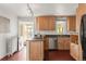 Updated kitchen with sleek countertops, stainless steel appliances, and convenient access to the sunroom at 2845 Quitman St, Denver, CO 80212