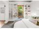 Main bedroom with built-in shelves, a window view, and a comfortable bed at 2845 Quitman St, Denver, CO 80212