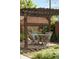 Outdoor dining area with a wooden pergola, brick patio, and manicured landscaping at 2845 Quitman St, Denver, CO 80212