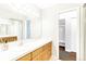 Bright bathroom with a large vanity, mirror and storage at 969 S Pearl St # 305, Denver, CO 80209