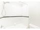 Bathroom features a shower over tub, tile surround, and white fixtures at 969 S Pearl St # 305, Denver, CO 80209