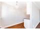Chandelier lighting highlights the dining area with hardwood floors at 969 S Pearl St # 305, Denver, CO 80209
