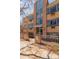 Apartment building entryway framed by brick columns and a full-height glass facade at 969 S Pearl St # 305, Denver, CO 80209
