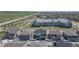 Aerial view of neighborhood featuring modern townhomes and a nearby apartment complex at 2455 Alpine St, Longmont, CO 80504